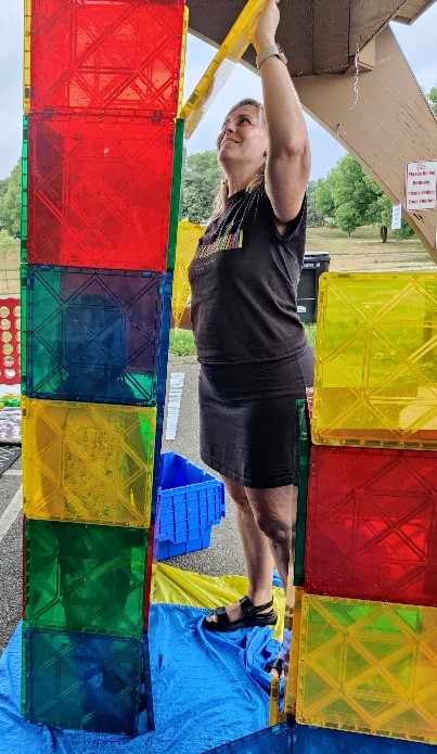 Library staff building giant block towers with youngest attendees of the event