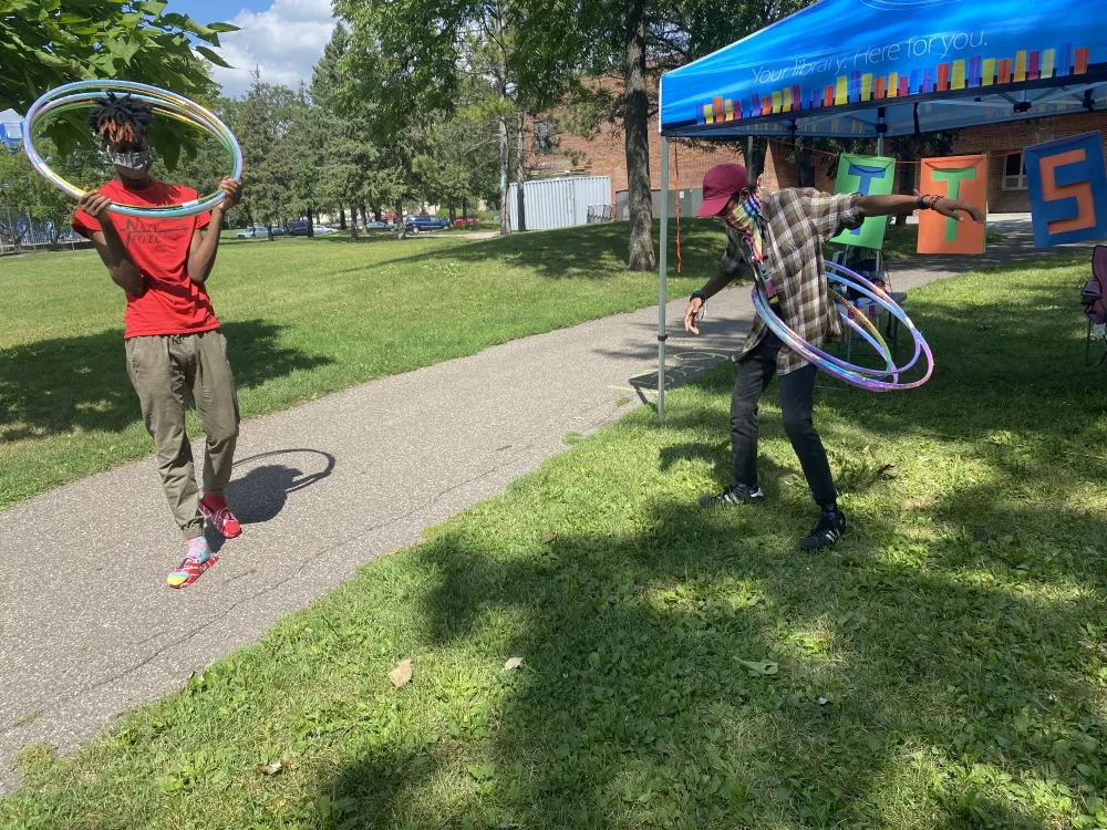 Two Teen Tech Squad Leaders playing games in the park