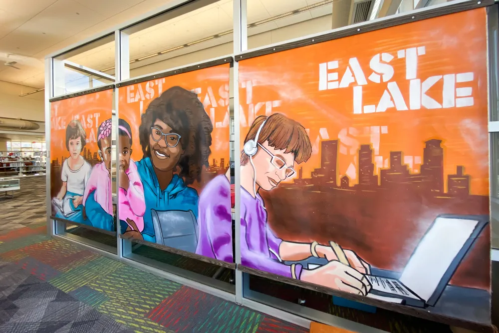 East Lake Library murals by Reggie LeFlore featuring a diverse group of people using local library
