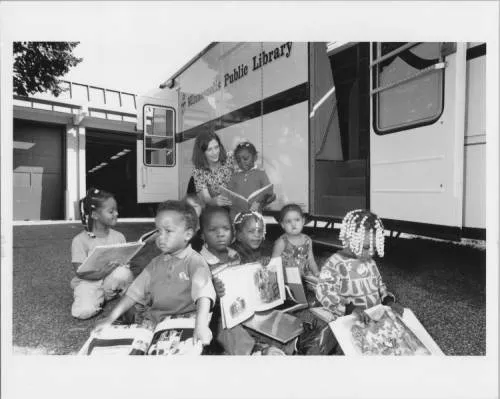 Bookmobile outside North Regional Library, 1990s
