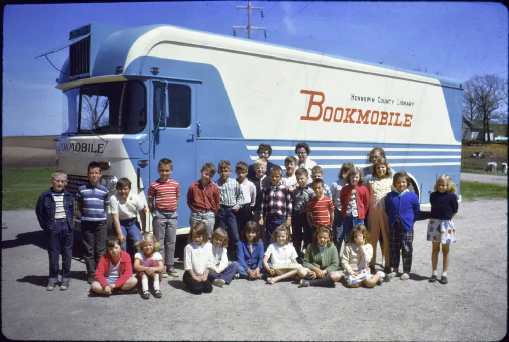 Kids outside the HCL bookmobile, 1960s