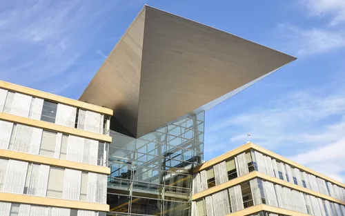 Approach the library on Hennepin Avenue and 4th street, and be greeted by a remarkable structure covered in bright windows and including a central “wing” taking flight.