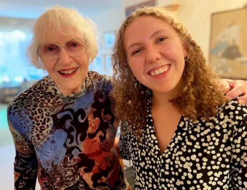 Nancy with her hand on Lizzie's shoulder smiling for a picture