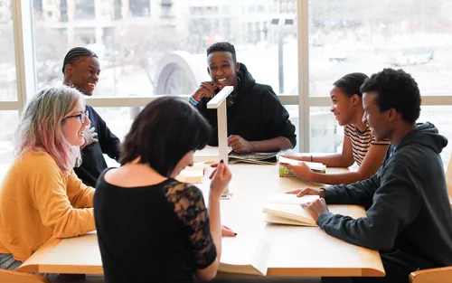 A group of teens use one of the many study spaces available at Minneapolis Central Library