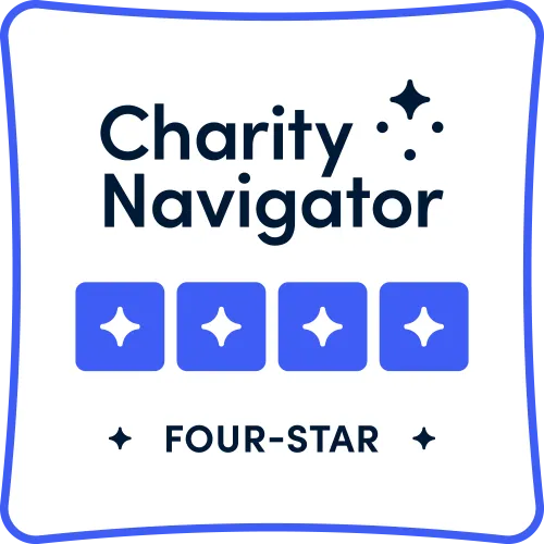 Four white star on blue squares with 'Charity Navigator text above and 'Four Stars' text below