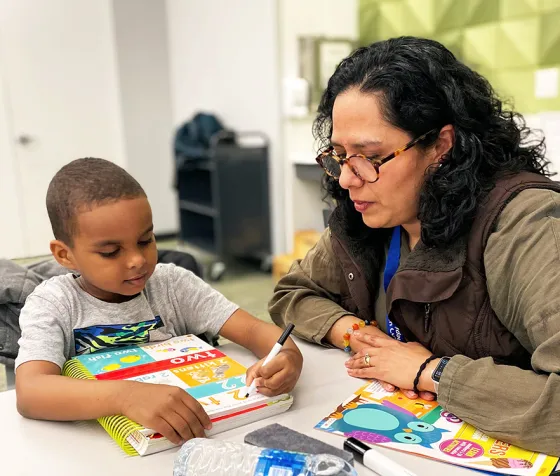 Eden Prairie Library Lead Tutor works with a student at Homework Help program