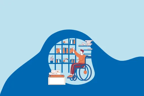 A person in a wheelchair selects a book at a library. 