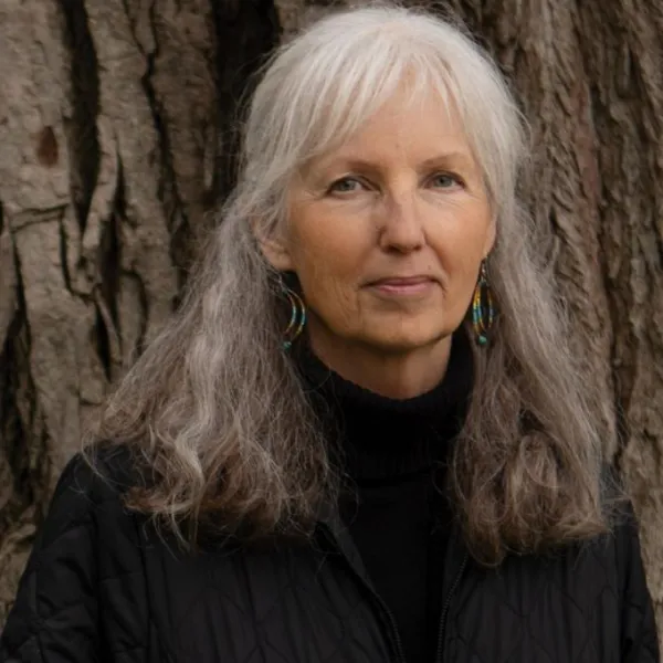 Diane Wilson standing in front of a large tree