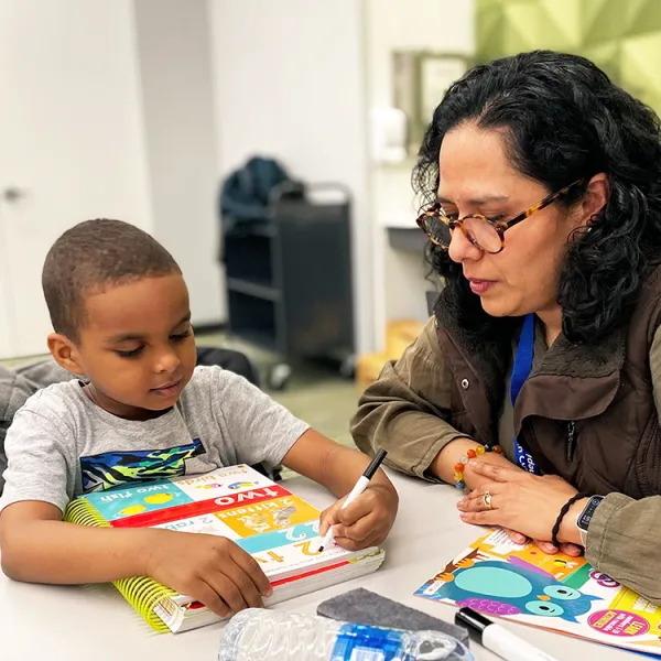 Eden Prairie Lead Tutor works with a student at Homework Help program